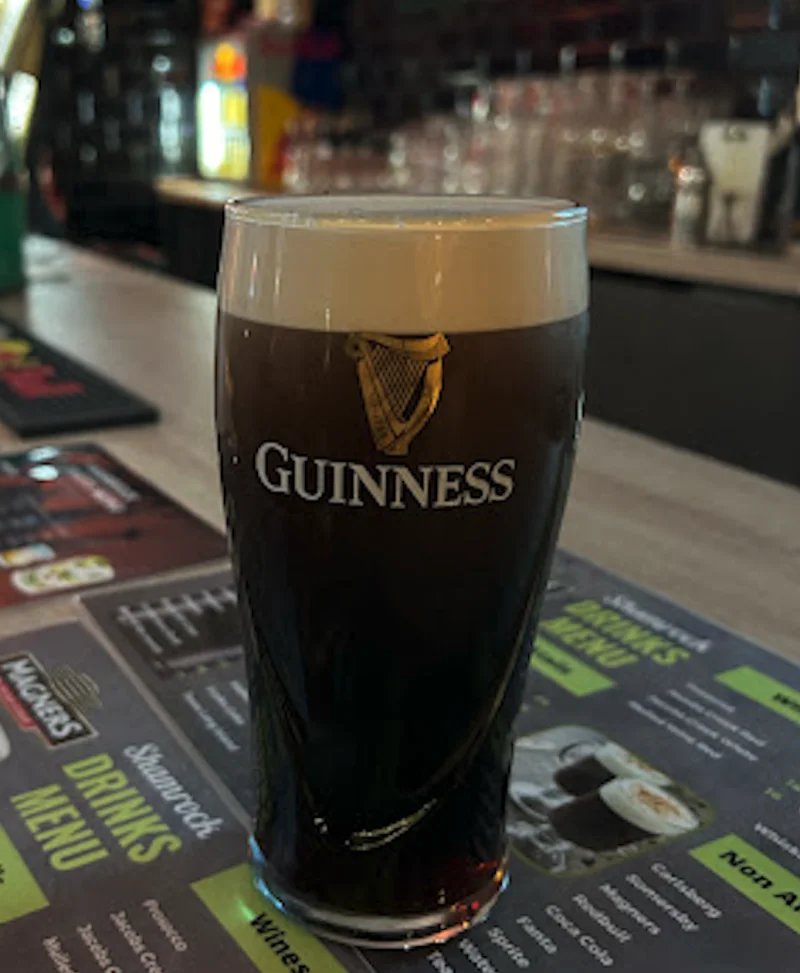 Pint of Guinness with the harp logo, on the drinks menu at the Classic