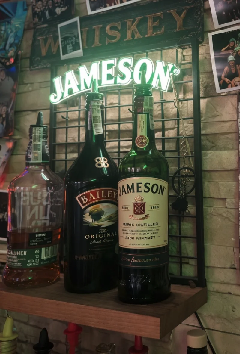 Whiskey shelf at the Classic with the WHISKEY sign and Jameson neon, bottles of Bulleit, Baileys and Jameson below