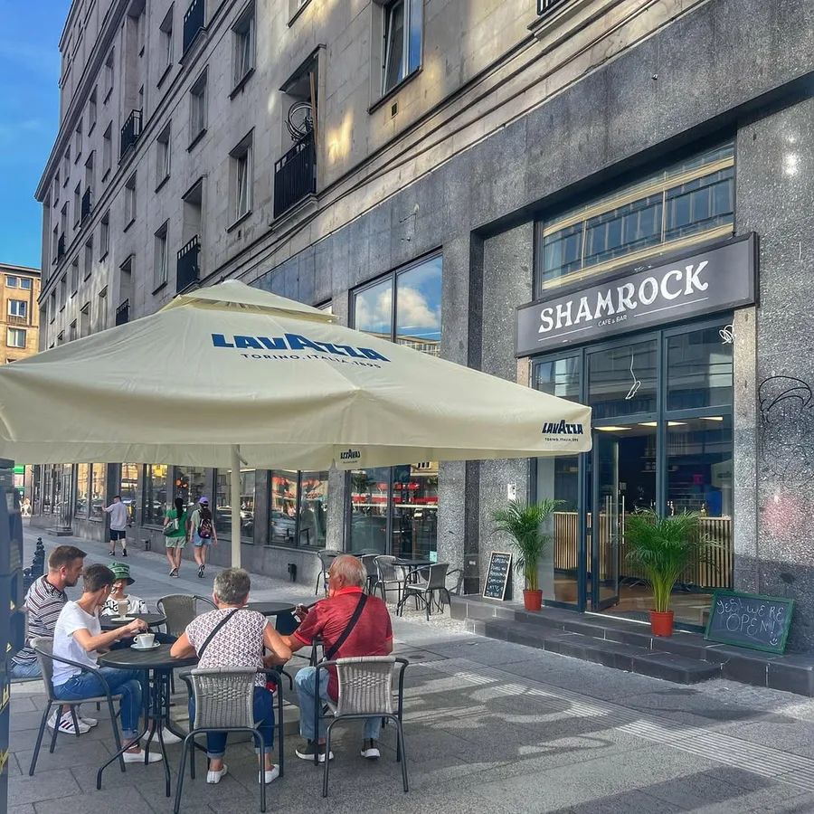 Sports Bar patio with tables and umbrella on Krucza