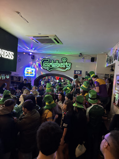 Crowd packed in at the Classic on St. Patrick's night, singing, green in every corner
