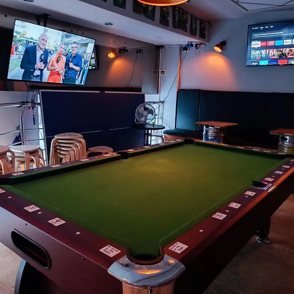 Pool table and TV area on the second floor